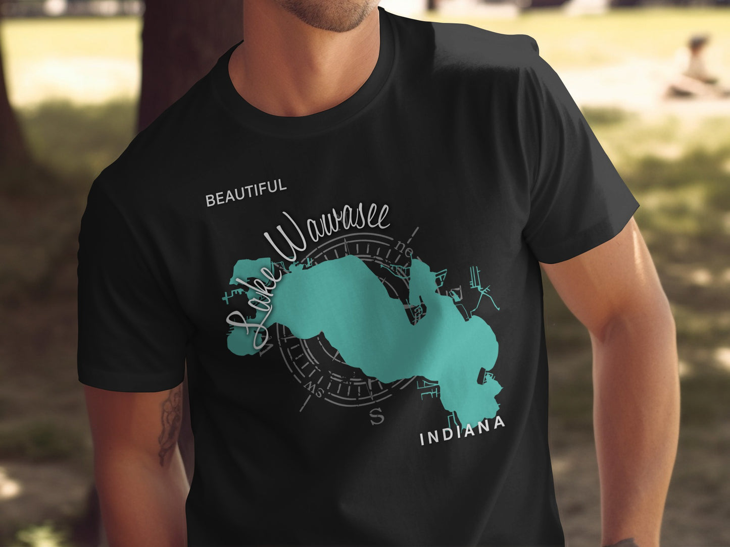 Black t-shirt with "Lake Wawasee Indiana" map graphic and compass.