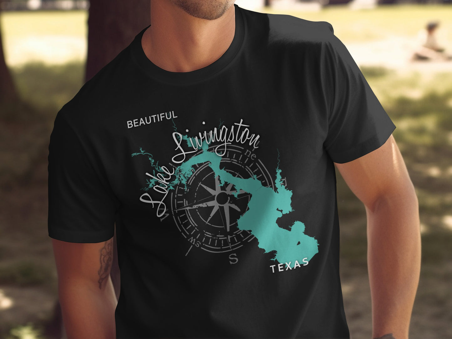 Black t-shirt with a teal compass and map of Lake Livingston, Texas.