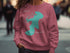 Pink sweatshirt featuring a teal map outline of the
"Beautiful Lake" and "New Hampshire".