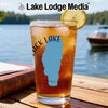 Glass of iced tea with "Black Lake" Idaho silhouette, on a wooden table.