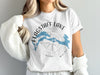 White t-shirt with blue Flagstaff Lake graphic and compass rose, text reads Maine