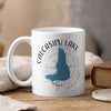 White mug with Calcasieu Lake map and compass design, "Louisiana" text.