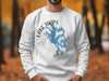White sweatshirt with blue Lake Tapps, Washington graphic and compass rose.