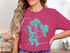 Pink t-shirt featuring a teal outline of Lake Massabesic, New Hampshire.