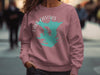 Dusty rose sweatshirt with teal Lake Casitas California graphic and compass rose detail.