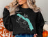 Black sweatshirt with "Beautiful Eklutna Lake Alaska" map and compass design.