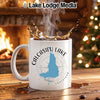 White mug with Calcasieu Lake Louisiana design and splash of coffee.