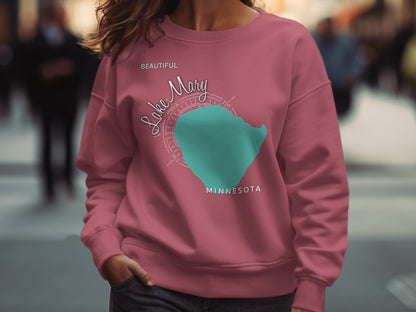 Pink sweatshirt with "Lake Mary Minnesota" text and turquoise map outline.