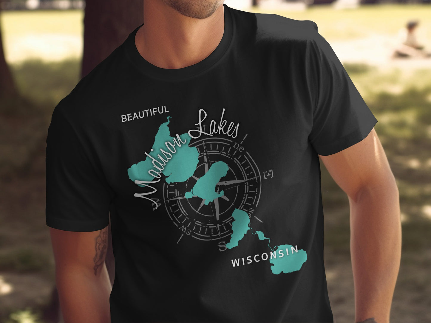Dark t-shirt with "Beautiful Madison Lakes Wisconsin" text and compass rose.