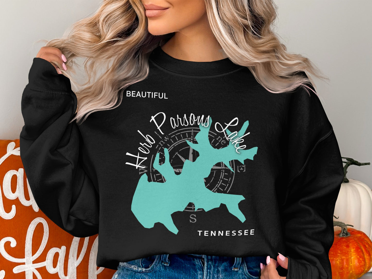 Black sweatshirt with turquoise Parsons Lake map and compass rose.