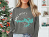 Gray sweatshirt with turquoise Lake Spivey shape and compass graphic.