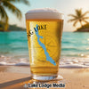 Glass of beer on a beach with a compass and "Long Lake Maine" map graphic.