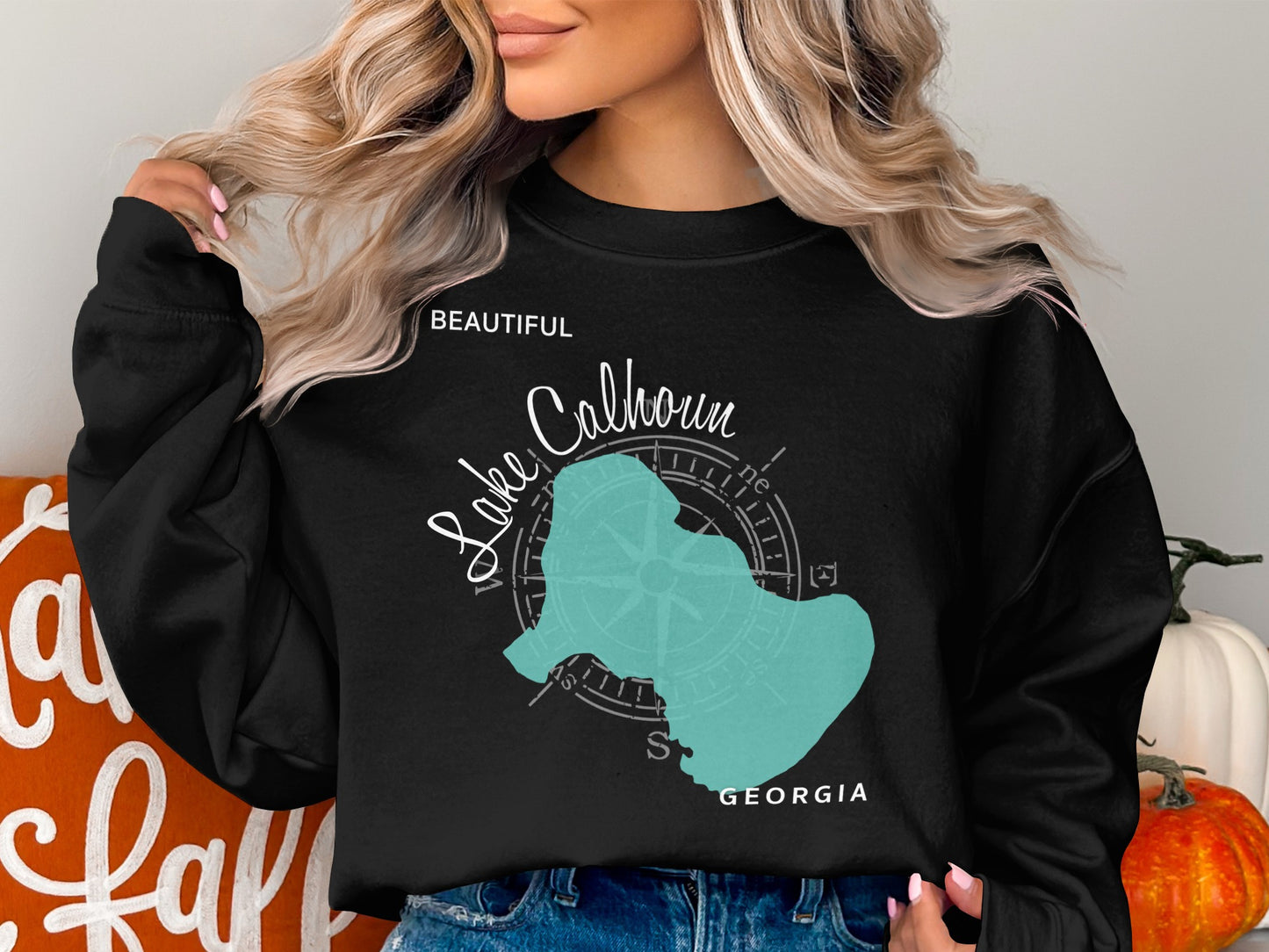 Black sweatshirt with "Beautiful Lake Calhoun Georgia" and compass rose graphic.