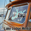 Sticker on boat window shows Shelbyville Life map and "Lake Lodge Media" text logo.
