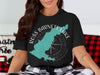 Black t-shirt with graphic of turquoise Ross Barnett Lake and compass, text reads "Ross Barnett Lake Mississippi"