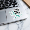 Sticker with "High Rock Life" text and teal lake outline on a laptop.