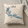 Cream pillow with blue Rainy Lake map graphic and compass rose.