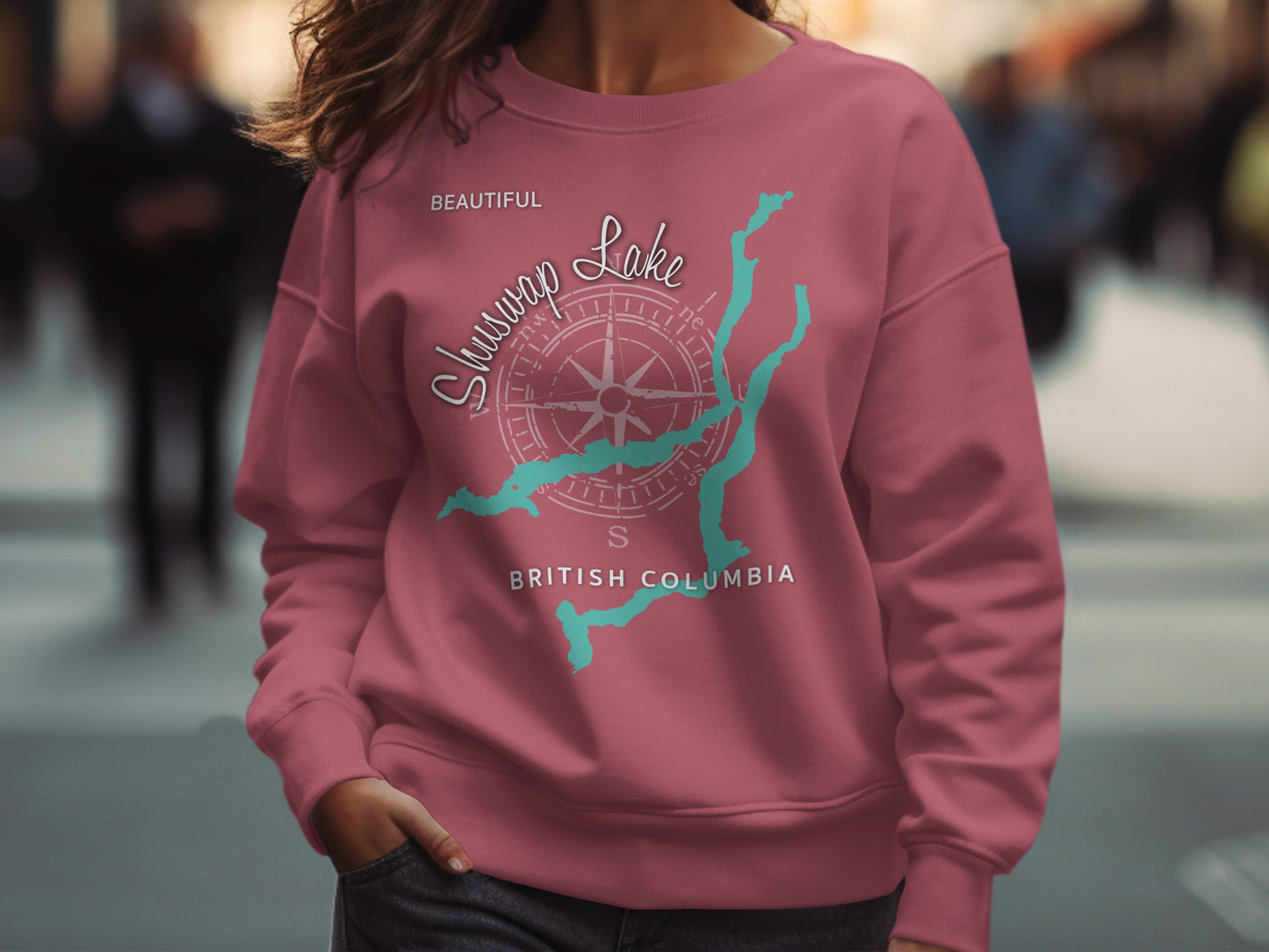 Maroon sweatshirt with a compass rose graphic and "Shuswap Lake British Columbia" text.