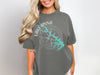 Woman wearing a grey t-shirt with "Lake Anna Virginia" and compass rose graphic.