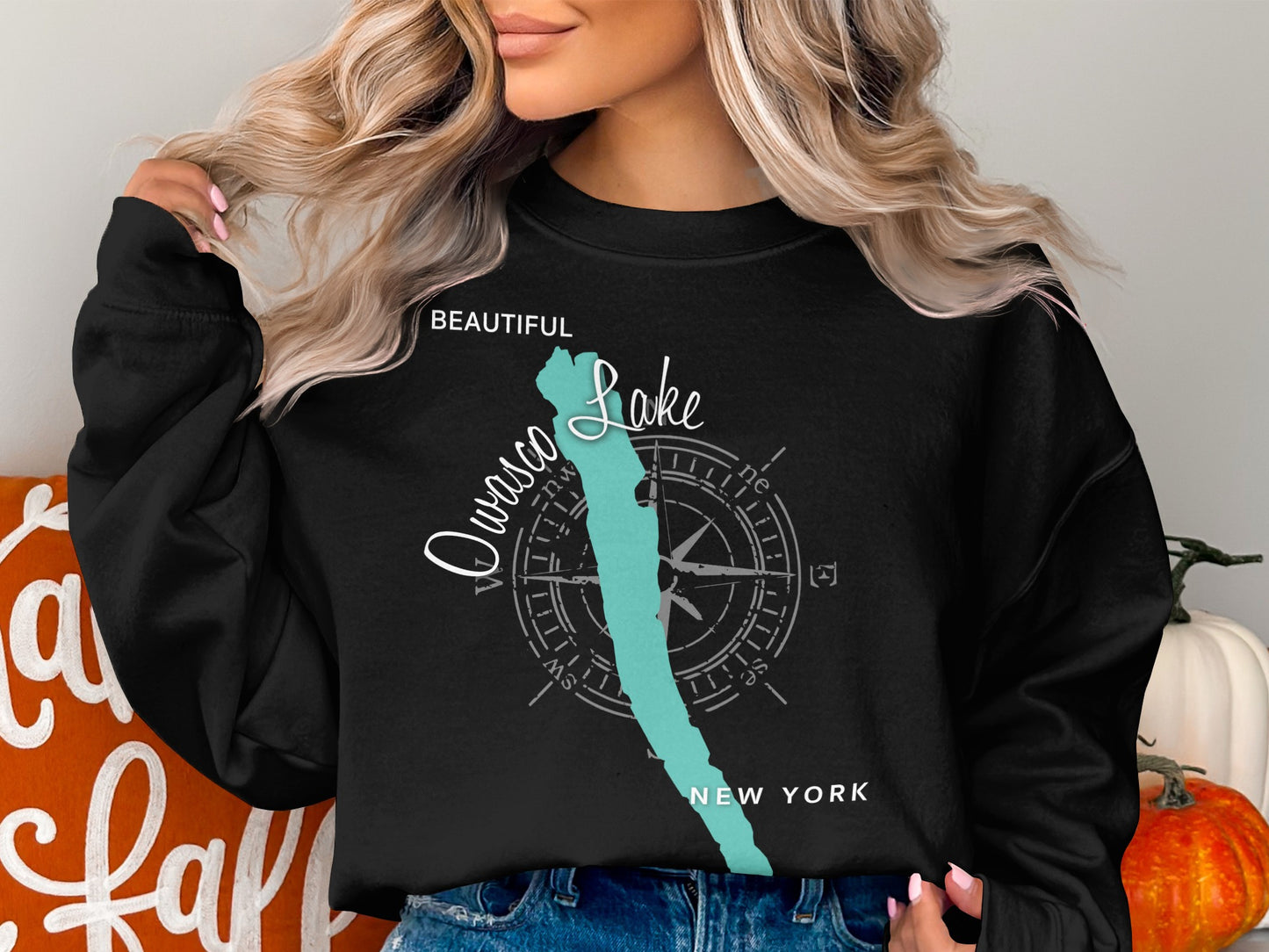 Black sweatshirt with "Owasco Lake, New York" and compass graphic.