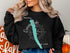 Black sweatshirt with "Owasco Lake, New York" and compass graphic.