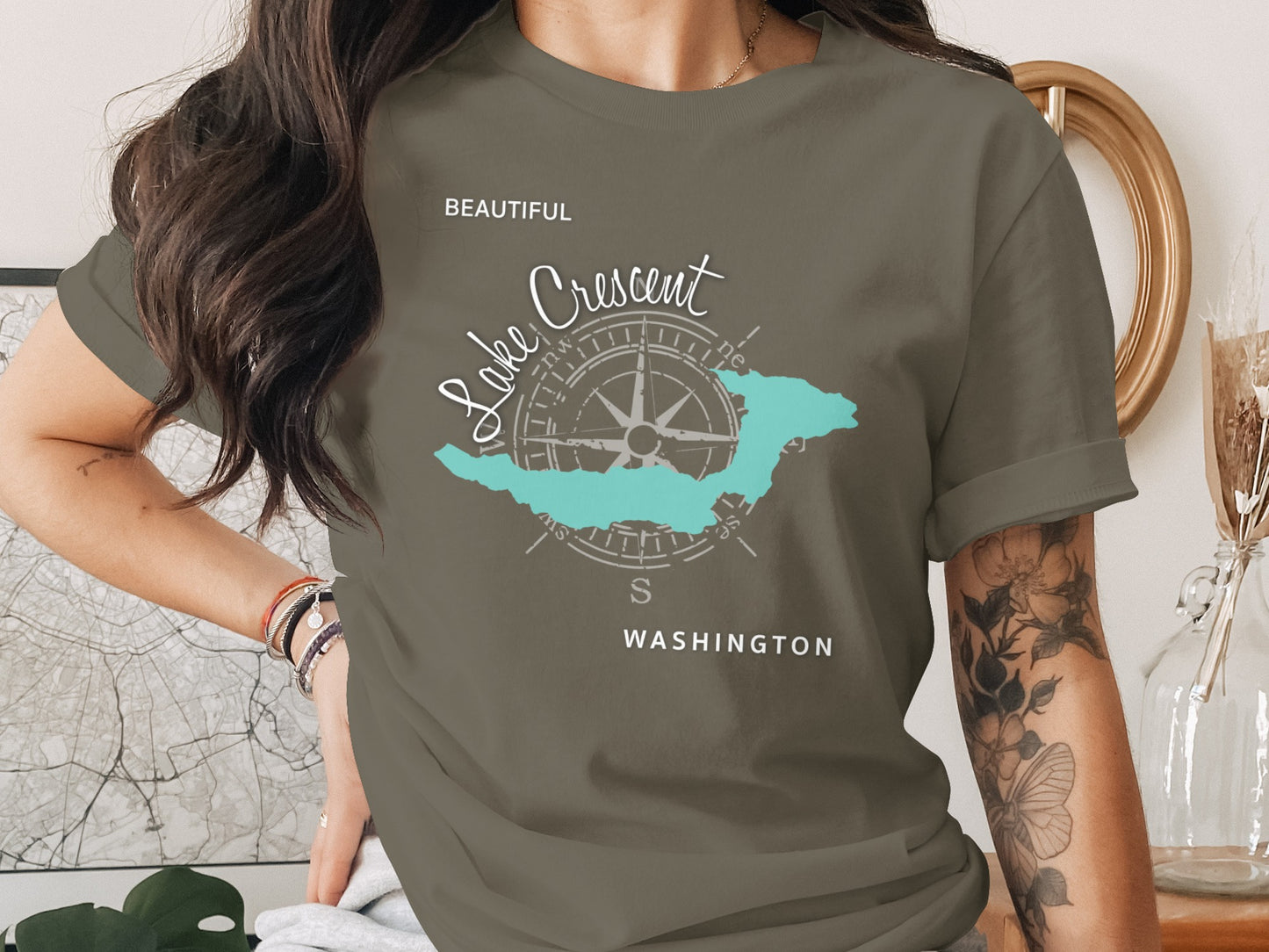 Olive green t-shirt featuring a compass rose with "Lake Crescent" and "Washington" text.