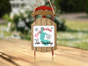 Sled ornament with "Merry Christmas FROM Lake Tohopekaliga" text and lake silhouette.