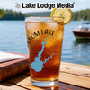 Glass with Folsom Lake map, compass, lemon slice, and Lake Lodge Media text.