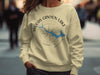 Light yellow sweatshirt with "Woods Canyon Lake Arizona" graphic and compass design.