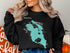 Black sweatshirt with turquoise outline map of Lake Kissimmee, Florida.
