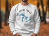 White sweatshirt on a man with "The Great Lakes" and blue map on a compass design.
