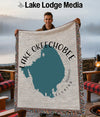 Lake Okeechobee Florida map blanket held by a smiling man outdoors.