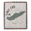 Woven throw with Lake Erie map silhouette and compass rose, copyright Lake Lodge Media LLC.