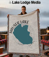 Hauser Lake Idaho woven blanket held by a man with a lake background.