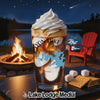 Glass with whipped cream and lake graphic, with s'mores ingredients by a campfire.