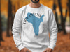 White sweatshirt with blue Lake Stevens Washington map and compass graphic.