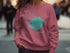 Crater Lake Oregon map graphic on maroon crewneck sweatshirt.