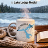 White mug with Nantahala Lake map and compass, steam rising, by a window.