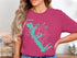 Pink t-shirt featuring a teal outline map of Cedar Creek Lake, Texas.