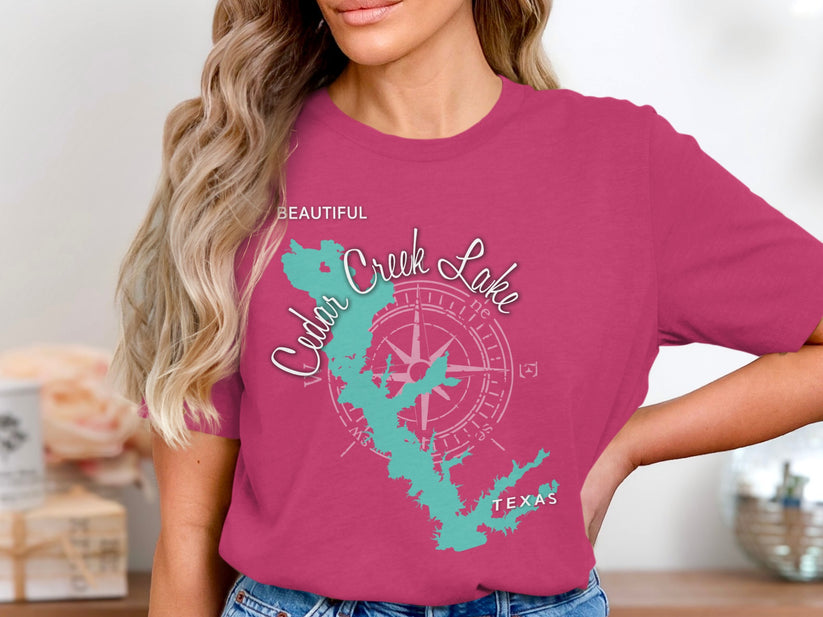 Pink t-shirt featuring a teal outline map of Cedar Creek Lake, Texas.