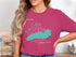 Teal Lake Ontario map on pink t-shirt with compass rose and text.