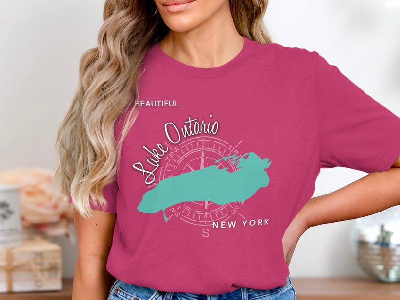 Teal Lake Ontario map on pink t-shirt with compass rose and text.