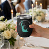 Black tumbler with Parker Canyon Lake map and compass design held by a hand.