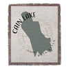 Woven blanket featuring a map of Cain Lake, Washington with compass rose.