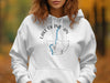 White hoodie with "Lake Okanagan British Columbia" and compass graphic.
