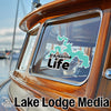 Sticker with teal map of D'Arbonne and "Life" text on boat window.