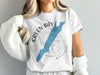 White t-shirt with Green Bay Wisconsin map design and compass graphic.