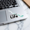 Sticker with "Panorama Life" text and teal lake outline on laptop.