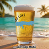 Cold beer in a glass on a beach with "GRAND LAKE MISSISSIPPI" text.