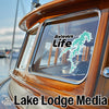 Belews Life graphic sticker on a boat window with Lake Lodge Media text.